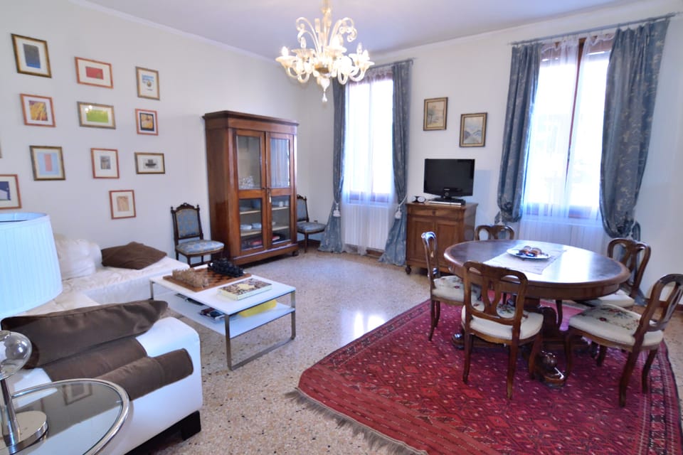 Apartment, 4 Bedrooms | Living area | Flat-screen TV, DVD player