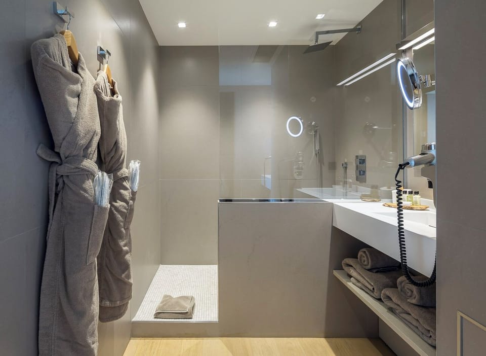 Designer toiletries, hair dryer, towels, soap