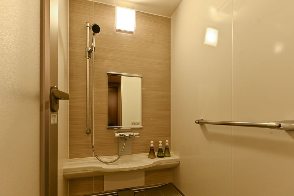 Twin Room with Shower- Non-Smoking | Bathroom | Hair dryer, slippers, towels, soap
