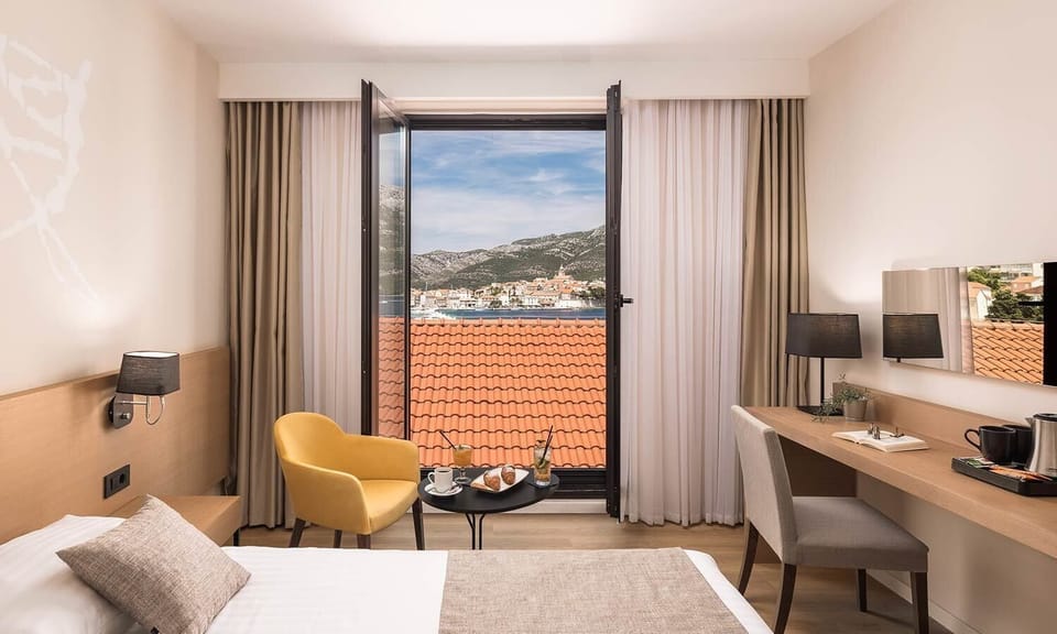 Standard double room, seaside | Hypo-allergenic bedding, minibar, in-room safe, free cribs/infant beds