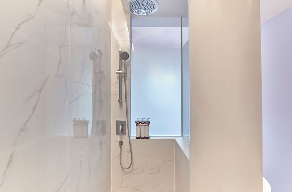 Shower, rainfall showerhead, hair dryer, towels