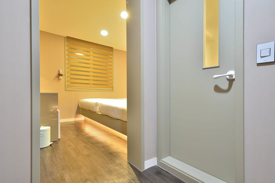 Family Room | Premium bedding, individually decorated, desk, soundproofing