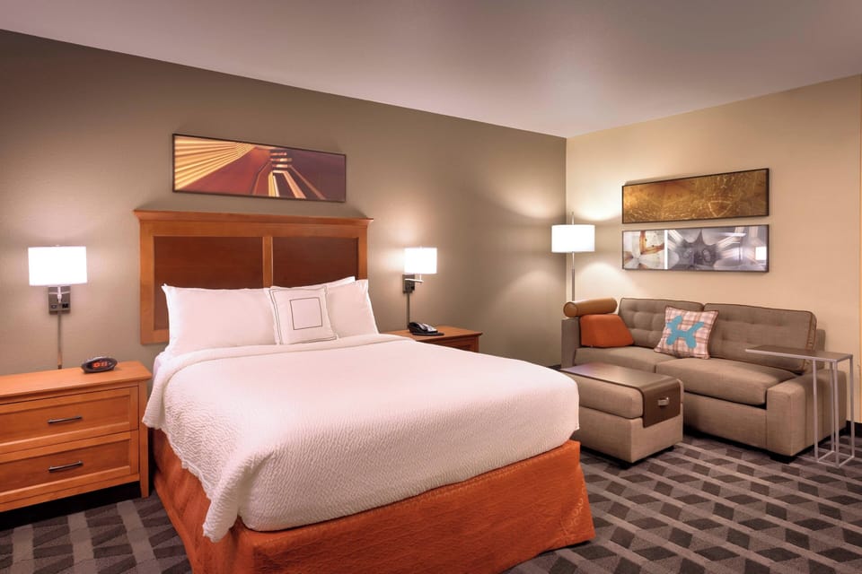 Premium bedding, desk, laptop workspace, iron/ironing board