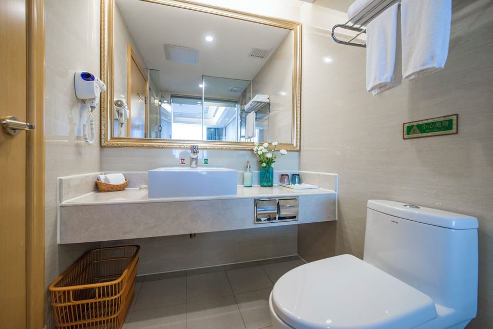 Shower, free toiletries, slippers, towels