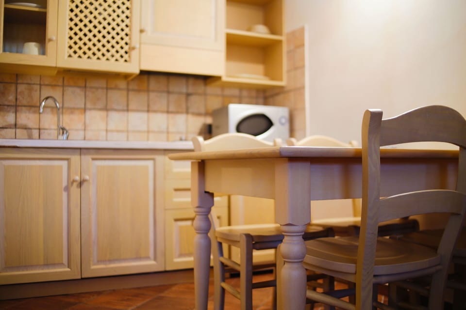 Apartment, 1 Bedroom, Kitchenette | Living area | 32-inch flat-screen TV with digital channels, TV