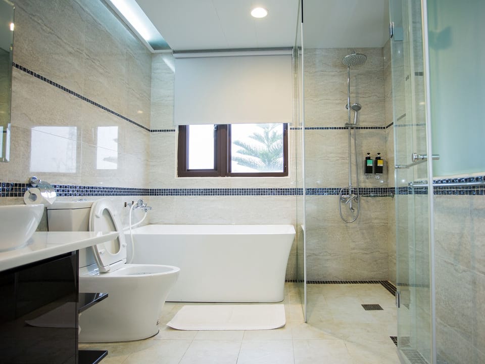 Comfort Quadruple Room | Bathroom | Shower, hair dryer, slippers, towels