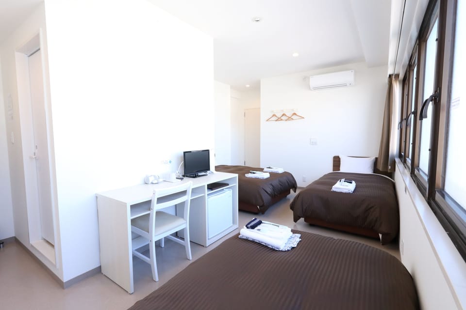 Standard Quadruple Room, Non Smoking, City View | Blackout drapes, free WiFi, bed sheets
