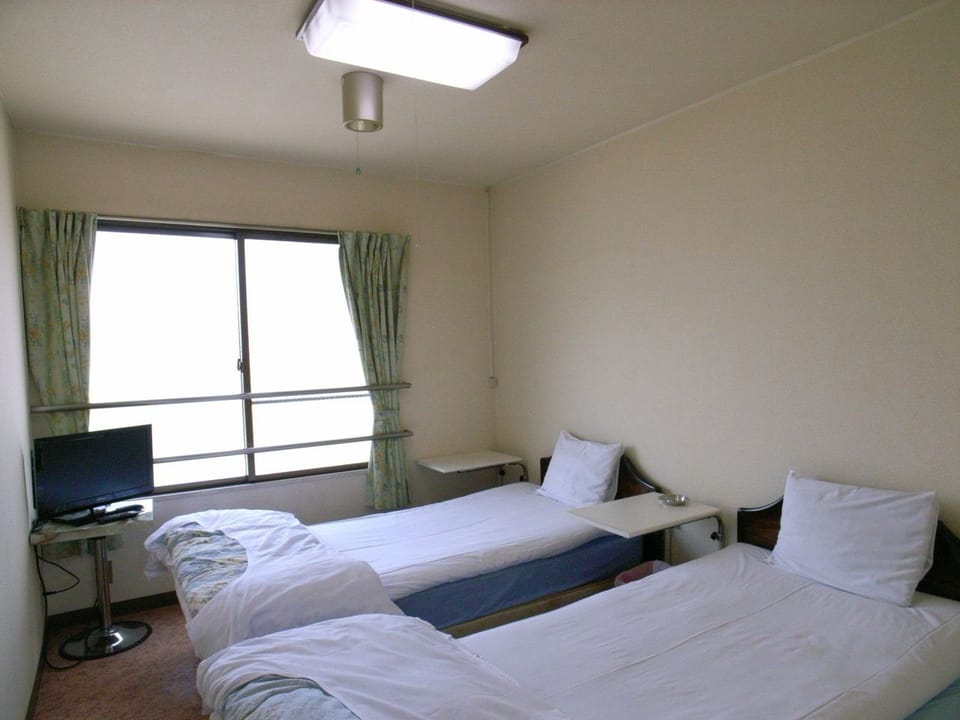 Twin Room, Shared Bathroom | Free WiFi