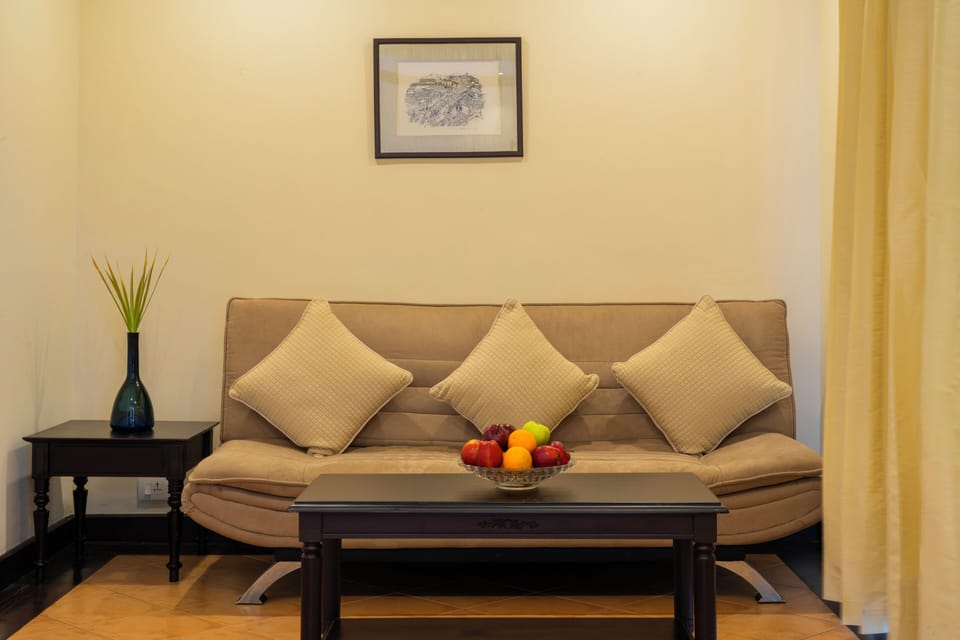 Deluxe Suite, 1 King Bed (Including Free wifi) | Living area | 30-cm TV with satellite channels