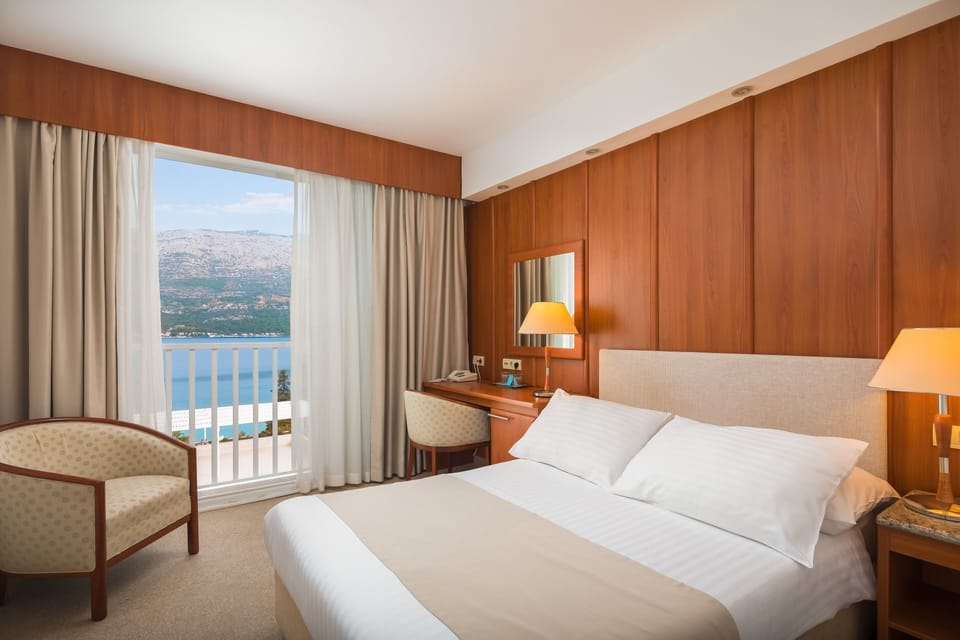 Standard double room, seaside | Minibar, in-room safe, desk, soundproofing