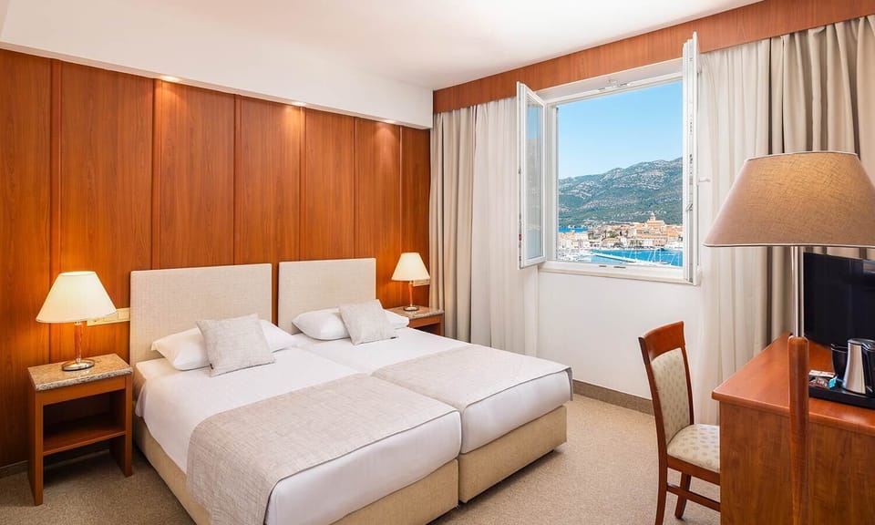 Superior junior suite, seaside | Minibar, in-room safe, desk, soundproofing