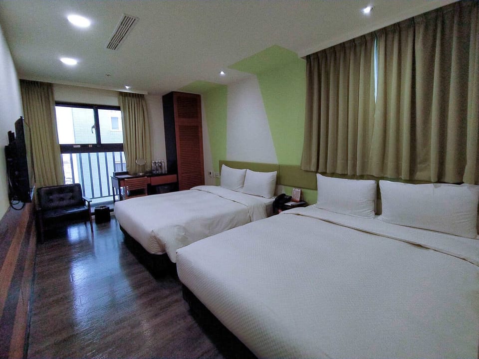 Elite Room | Down comforters, desk, laptop workspace, blackout drapes