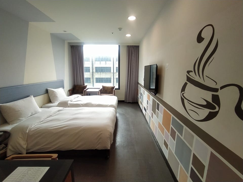 Deluxe Twin Room | Down comforters, desk, laptop workspace, blackout drapes