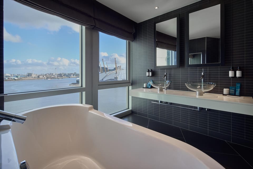 Shower, designer toiletries, hair dryer, towels