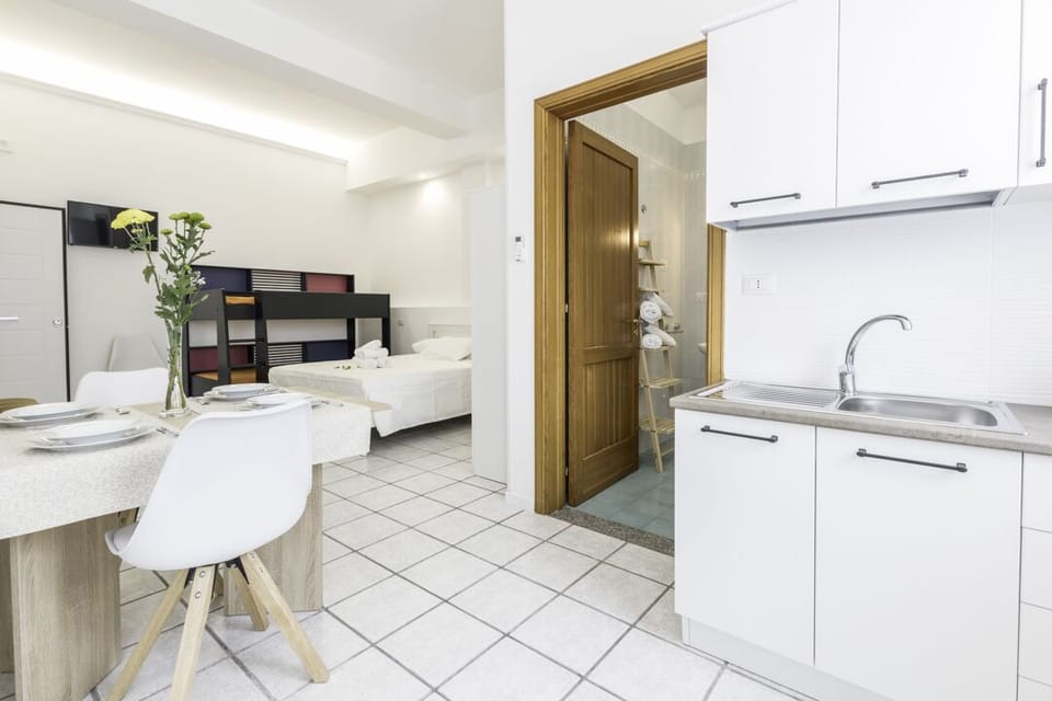 Studio Suite, Accessible | Private kitchen | Fridge, highchair