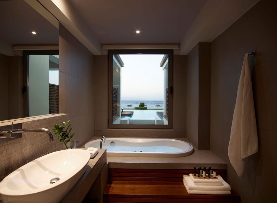 Grand Suite, Sea View (Beachfront Swim Up) | Bathroom | Shower, rainfall showerhead, designer toiletries, hair dryer