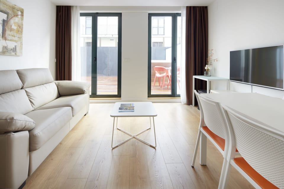 Suite, Terrace | Living room | Flat-screen TV