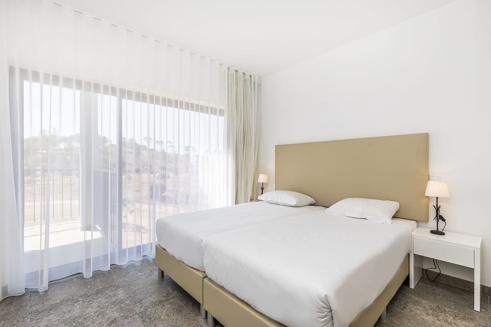 Apartment, 3 Bedrooms | Minibar, desk, laptop workspace, soundproofing