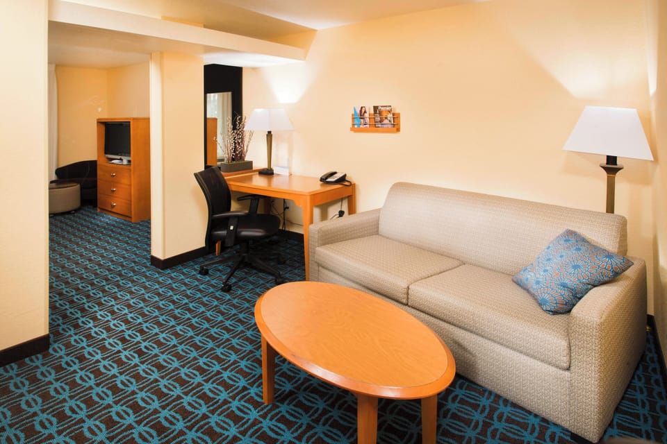 Premium bedding, desk, laptop workspace, iron/ironing board