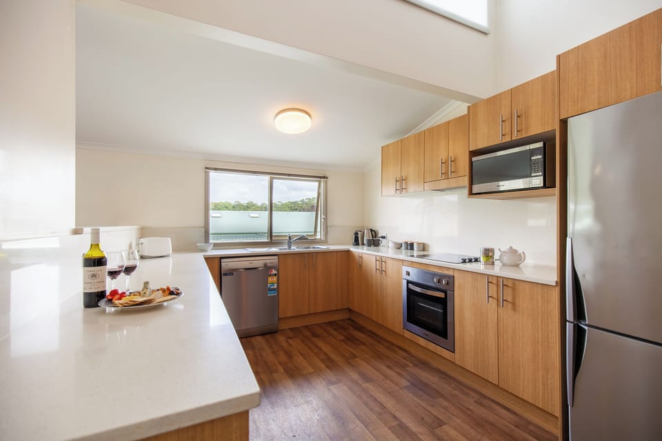 Three Bedroom Apartment | Private kitchen | Coffee/tea maker, fridge, electric kettle
