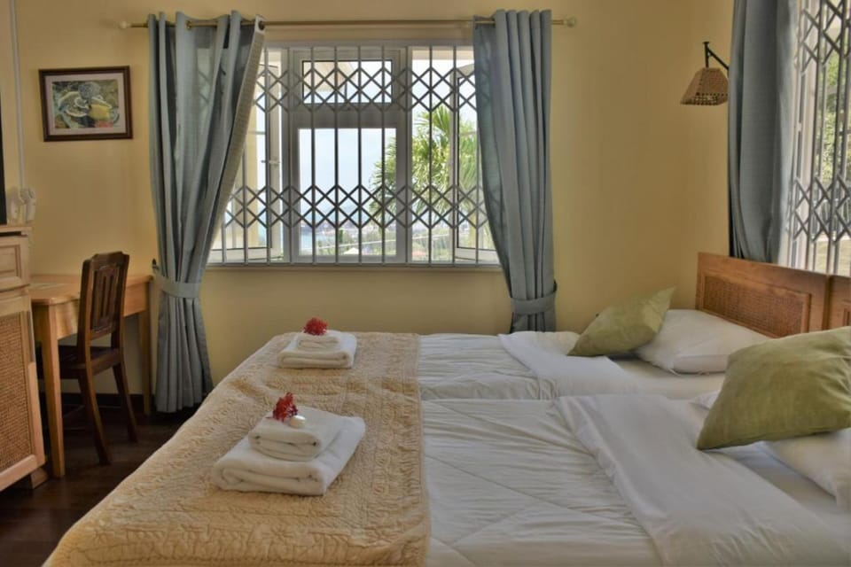 Twin Room | Minibar, desk, iron/ironing board, free WiFi