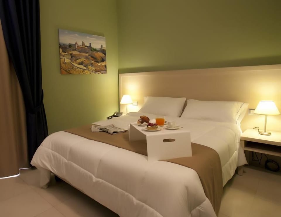 Premium bedding, down comforters, minibar, in-room safe