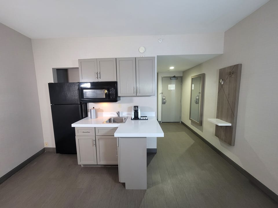 Suite, 1 Bedroom | Private kitchen | Mini-fridge, microwave, coffee/tea maker