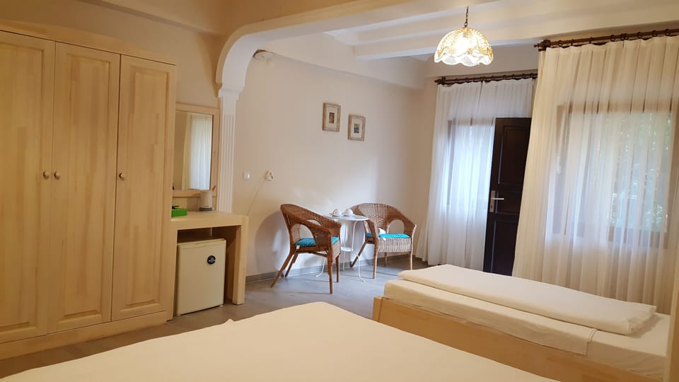 Triple Room, 1 Bedroom, Non Smoking, Garden View | Minibar, in-room safe, individually decorated, desk