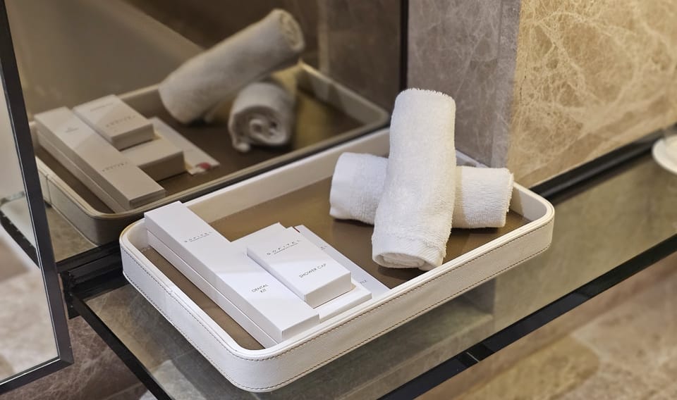 Separate tub and shower, designer toiletries, hair dryer, bathrobes