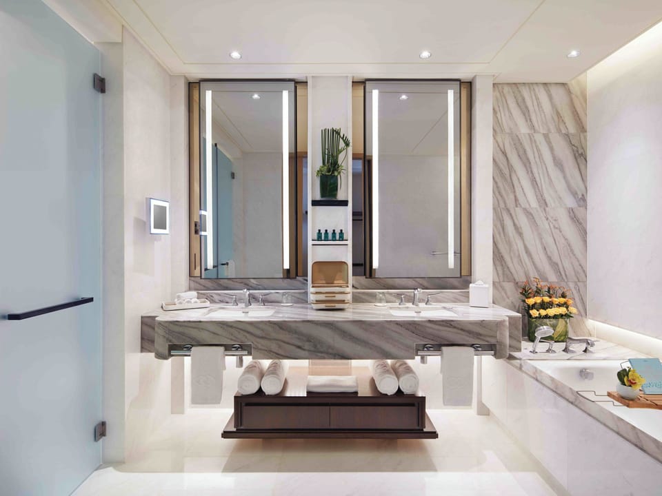 Separate tub and shower, designer toiletries, hair dryer, bathrobes