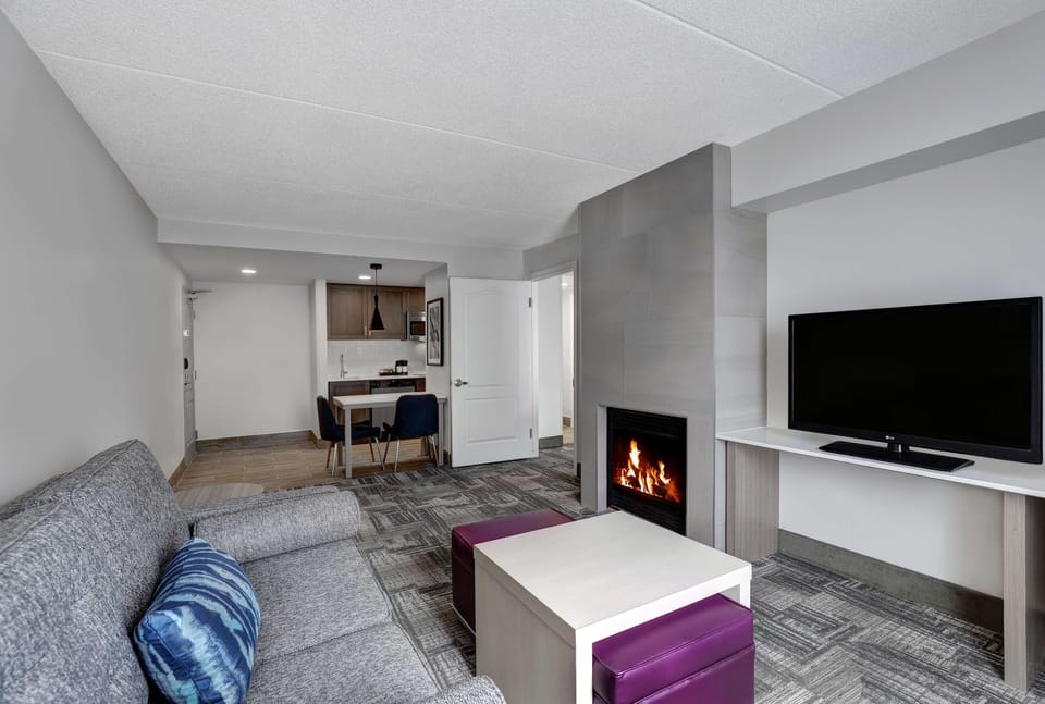 Suite, 1 Bedroom, Non Smoking, Fireplace (2 Queen Beds) | Living area | Flat-screen TV, pay movies