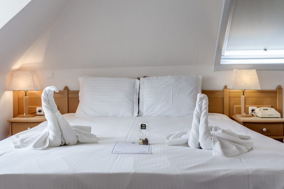 Family Triple Room, Multiple Beds, Refrigerator, City View | Minibar, in-room safe, desk, laptop workspace