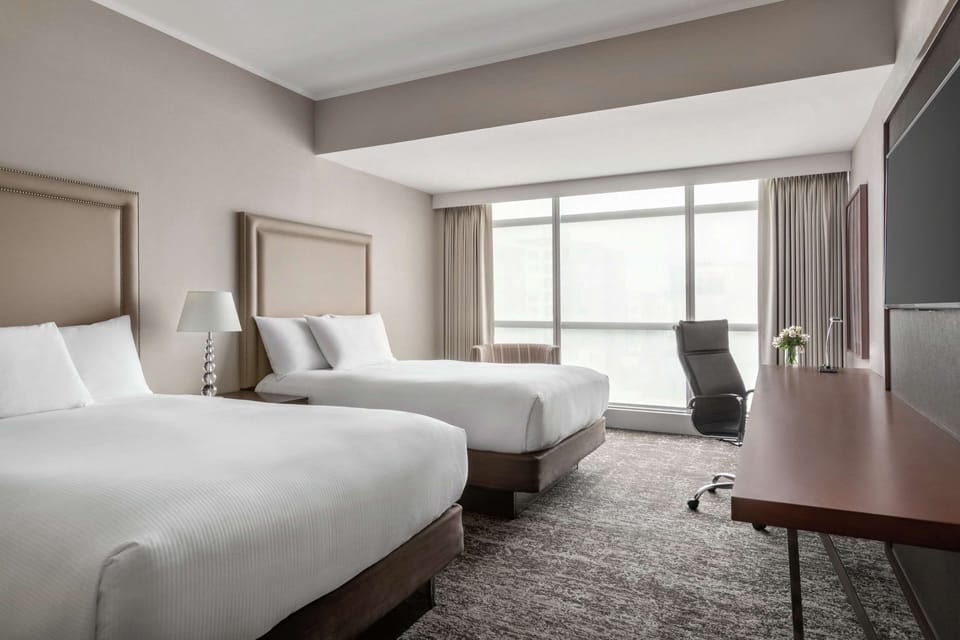 Suite, 2 Double Beds | Minibar, in-room safe, desk, laptop workspace