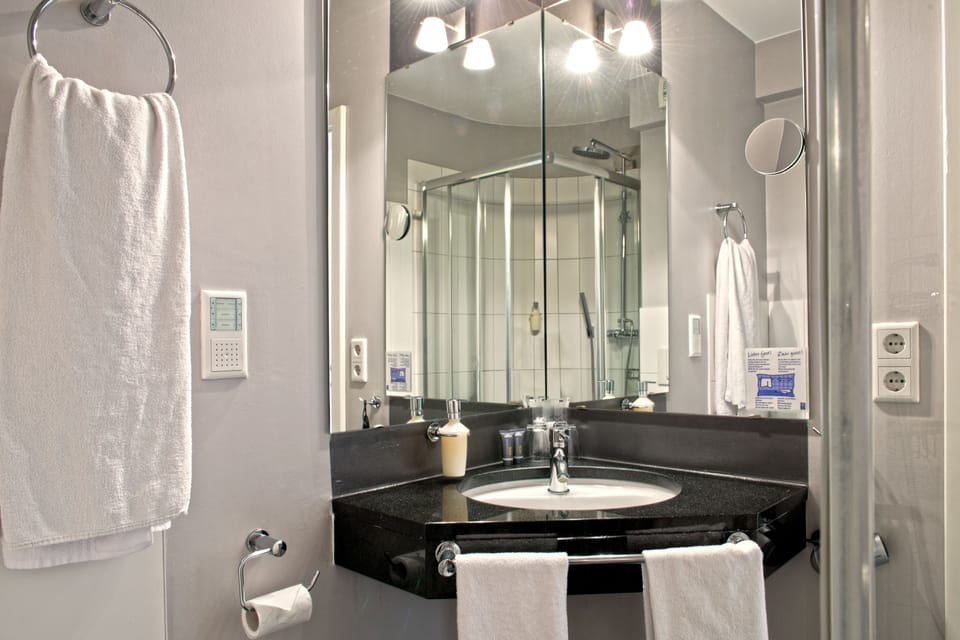 Shower, hair dryer, slippers, towels