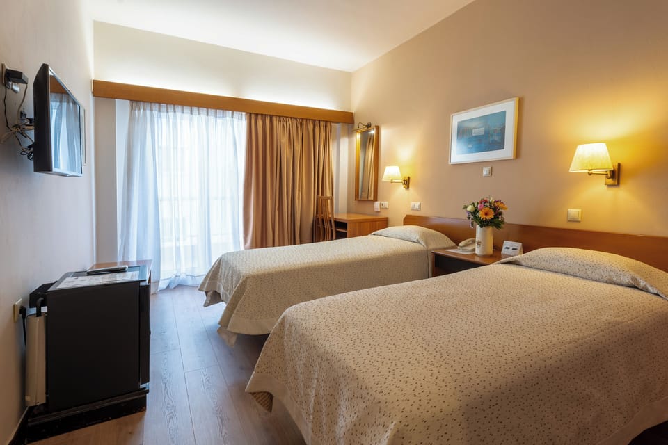 Standard Double Room, Balcony, City View | Minibar, in-room safe, desk, blackout drapes