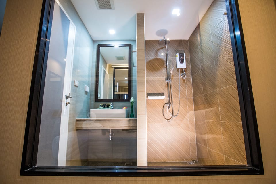 Standard Double Room | Bathroom | Shower, free toiletries, hair dryer, slippers