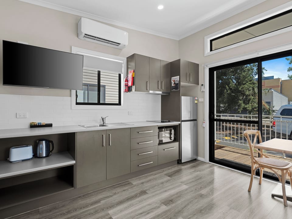 Deluxe Studio - Not Pet Friendly | Private kitchen | Shared fridge, microwave, stovetop, electric kettle