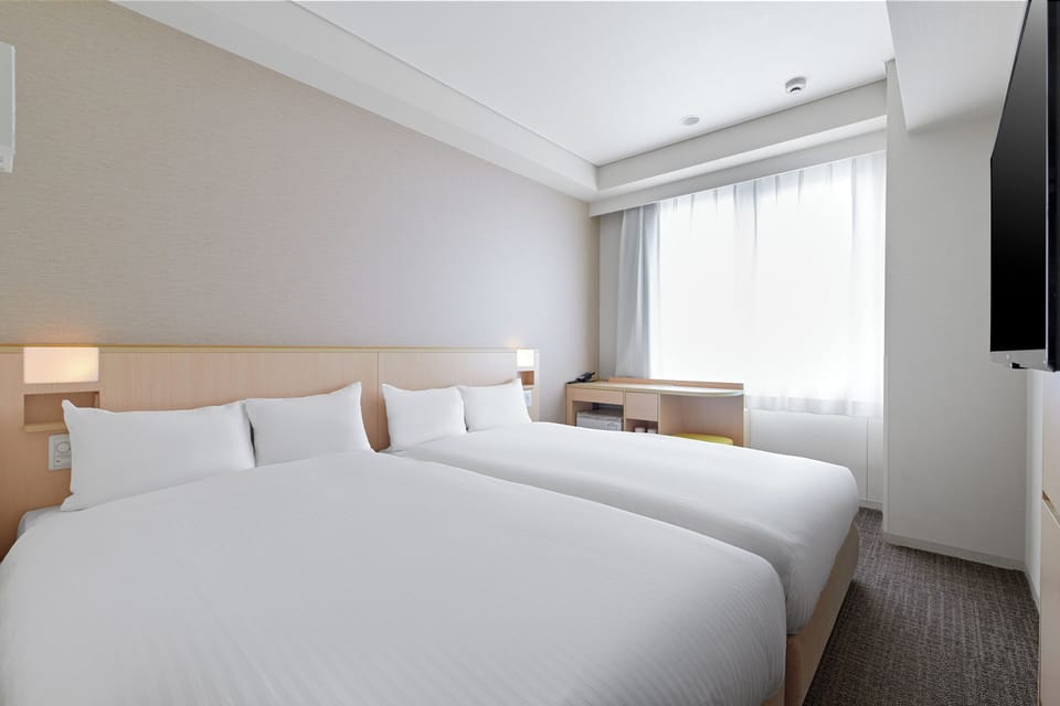Twin Room, Non Smoking | Desk, blackout drapes, free WiFi, bed sheets