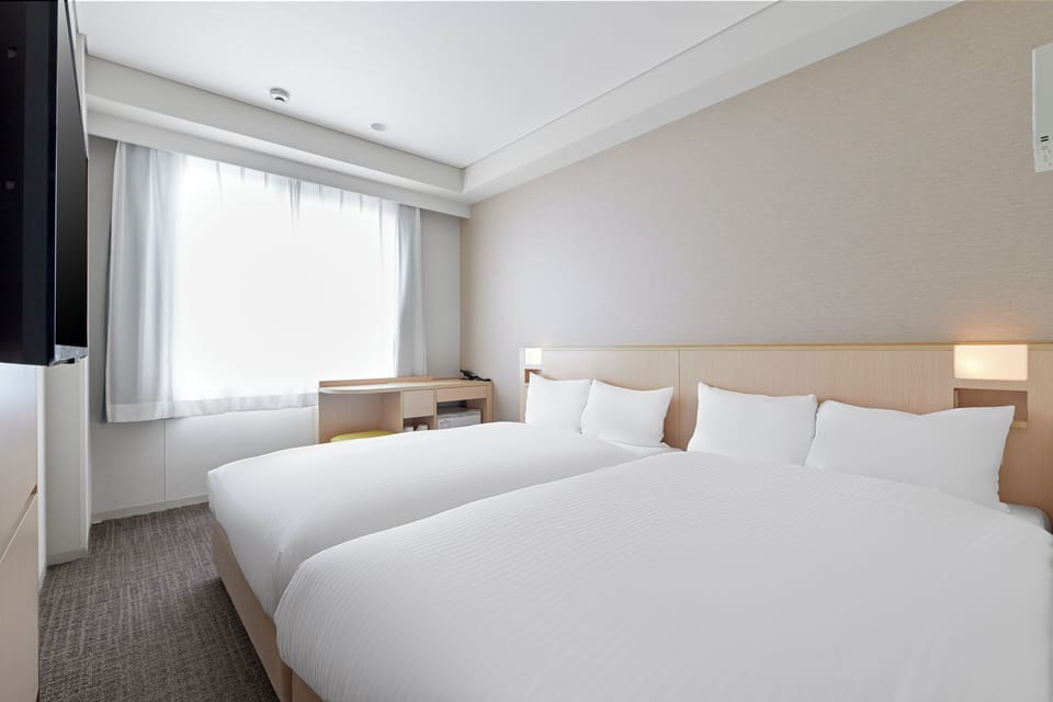 Twin Room, Non Smoking | Desk, blackout drapes, free WiFi, bed sheets