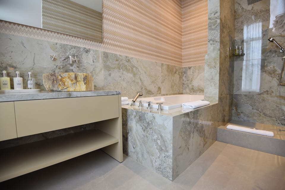 Deluxe Double Room | Bathroom | Designer toiletries, hair dryer, slippers, towels