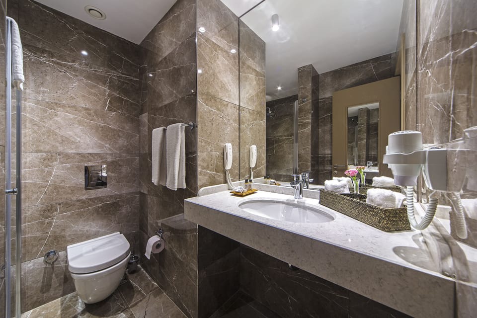 Superior Suite, Terrace | Bathroom | Shower, free toiletries, hair dryer, slippers
