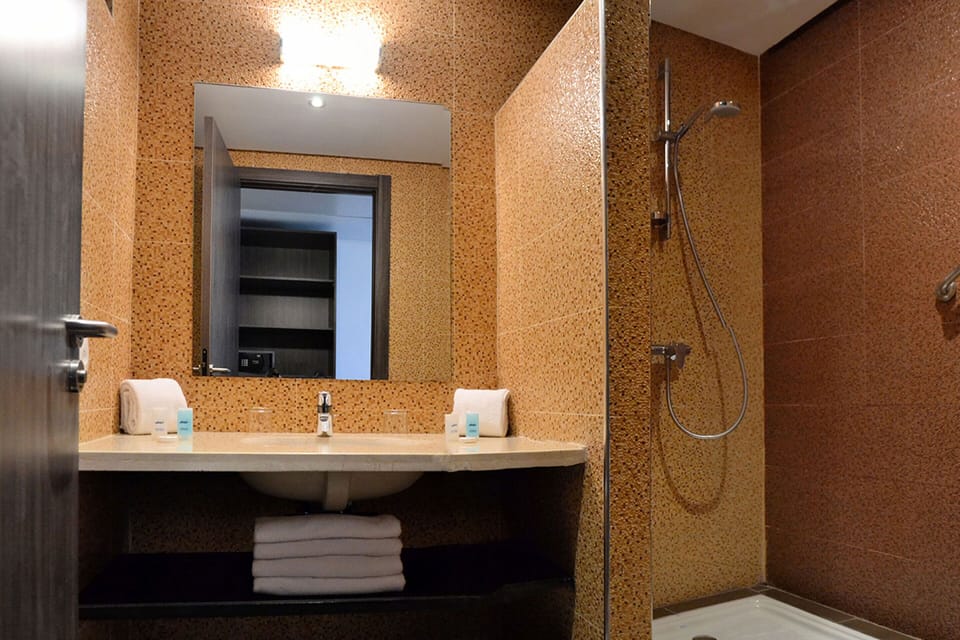 Shower, free toiletries, hair dryer, slippers
