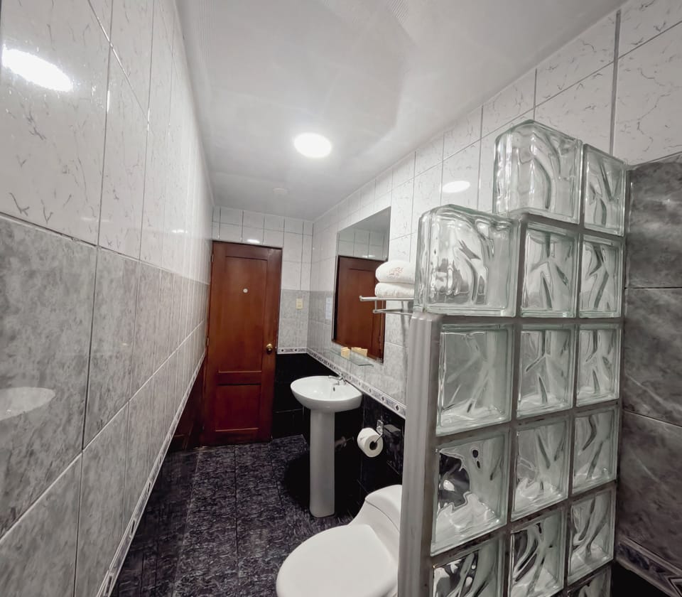 Classic Twin Room | Bathroom | Shower, rainfall showerhead, hair dryer (on request), towels