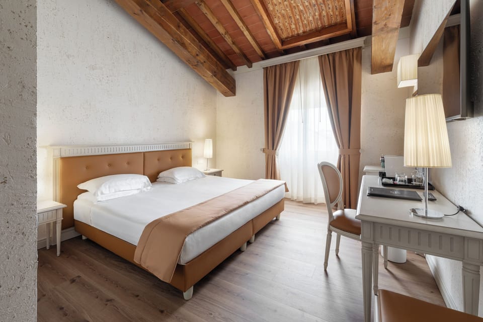 Premium bedding, down comforters, minibar, in-room safe