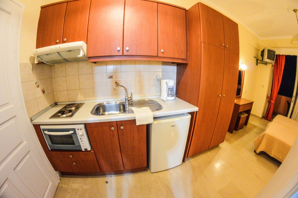 Apartment, 2 Bedrooms, Sea View, Ground Floor | Private kitchenette | Full-size fridge, coffee/tea maker, cookware/dishes/utensils