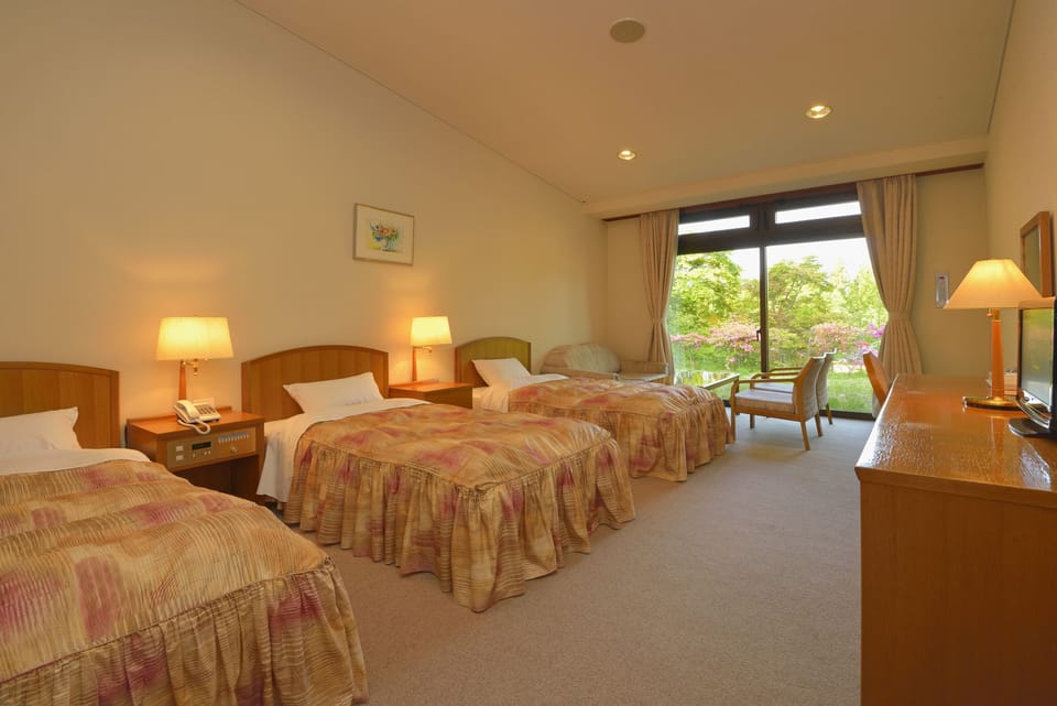 Quadruple Room, Main Building, Non Smoking | Down comforters, in-room safe, blackout drapes