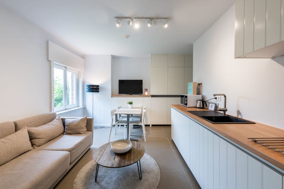 Family Studio, 2 Bedrooms, Kitchen | Living area | Flat-screen TV