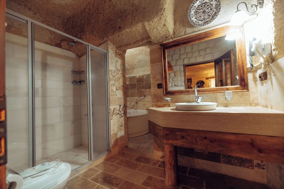 Cave Room | Bathroom | Hair dryer, slippers, towels, soap