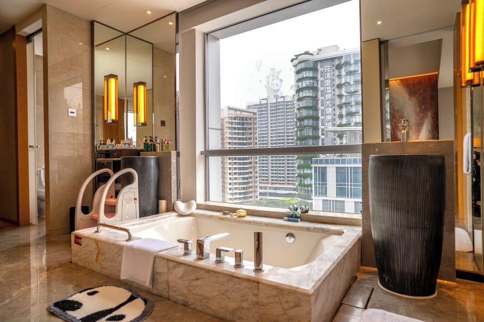 Junior Suite, Multiple Beds (Additional Living Area) | Bathroom | Rainfall showerhead, designer toiletries, hair dryer, bathrobes