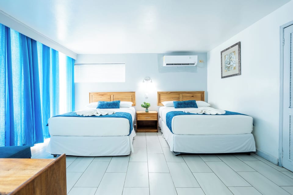 Standard Room, 2 Double Beds, Pool View | 1 bedroom, premium bedding, in-room safe, bed sheets